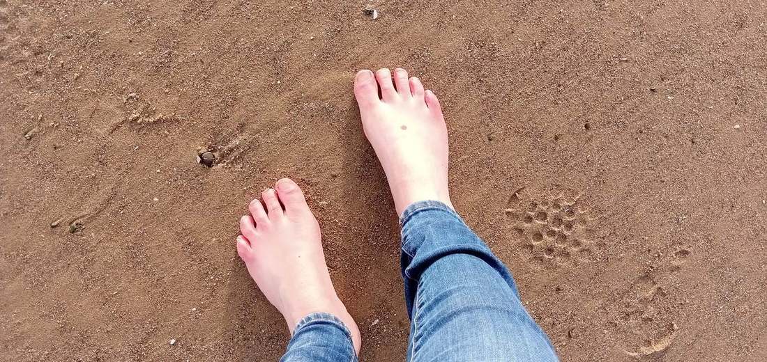 Bare feet on warm sand